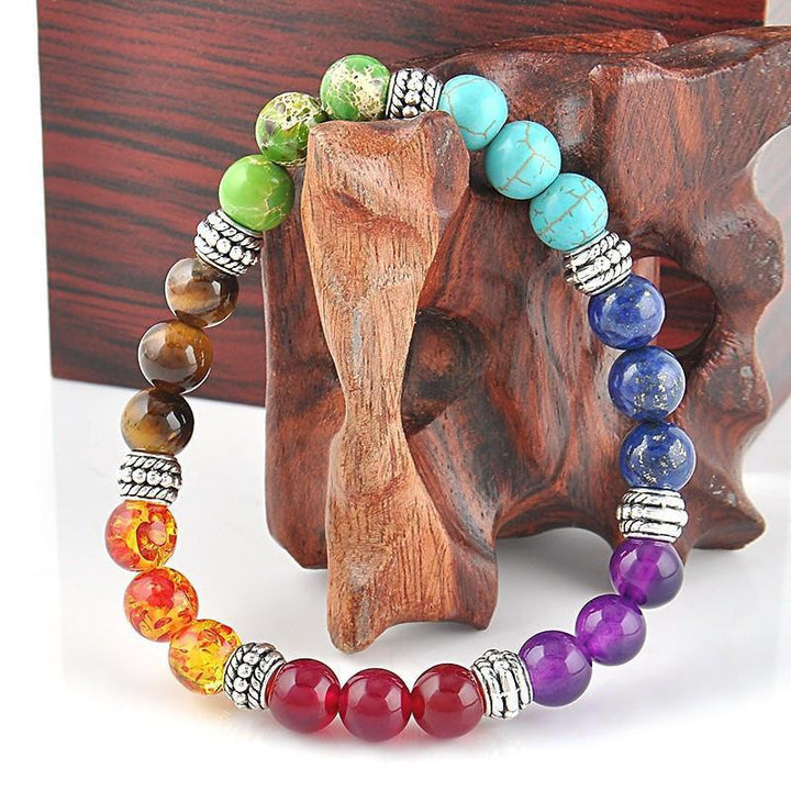 7 Chakra Crystals 8mm Bracelet on Larger Wood