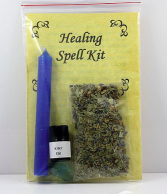 Healing Spell Kit blue candle, altar oil, fluorite gemstone, and a specialty bag of herbs